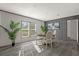 Bright dining area with four chairs and a round table at 1356 Cupid Ave, Christmas, FL 32709