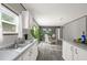 Modern kitchen with white cabinets and gray countertops at 1356 Cupid Ave, Christmas, FL 32709