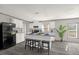 Modern kitchen with white cabinets and gray countertops at 1356 Cupid Ave, Christmas, FL 32709