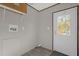 Functional laundry room with exterior access and shelving at 1356 Cupid Ave, Christmas, FL 32709
