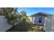 Landscaped side yard with fence and shed at 13867 Sw 31St Ct, Ocala, FL 34473