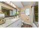 Bathroom with a large vanity, granite countertops, a large mirror, and a shower and tub combo at 1417 Borg Ln, Winter Springs, FL 32708