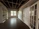 Bedroom featuring hardwood flooring, custom built-in cabinetry providing ample storage, and bright natural light at 14429 Windchime Ln, Orlando, FL 32837