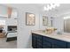 Double vanity bathroom with a view of a bedroom at 1977 Tohoqua Blvd, Kissimmee, FL 34744