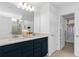 Modern bathroom with double vanity, walk-in shower, and large closet at 1977 Tohoqua Blvd, Kissimmee, FL 34744