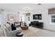 Living room with white shiplap wall and large TV at 1977 Tohoqua Blvd, Kissimmee, FL 34744