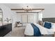 Main bedroom with cozy sitting area and wood beam accents at 1977 Tohoqua Blvd, Kissimmee, FL 34744