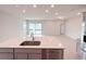 Spacious kitchen with an island and stainless steel appliances at 2206 Lovely Ln, Davenport, FL 33897