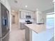 Kitchen with a large island, stainless steel appliances, and modern countertops at 2206 Lovely Ln, Davenport, FL 33897