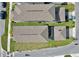 Aerial view of a residential neighborhood, showing roof details, landscaped yards, and proximity to street access at 2429 Volunteer Ave, Kissimmee, FL 34744