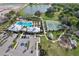 Community amenities including a pool, clubhouse, tennis court, playground, and parking area, nestled in a picturesque setting at 2429 Volunteer Ave, Kissimmee, FL 34744