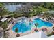 Large community pool with lounge area at 2429 Volunteer Ave, Kissimmee, FL 34744