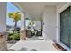 Inviting front porch with stylish seating, decorative columns, and a clear view of the surrounding neighborhood at 2429 Volunteer Ave, Kissimmee, FL 34744