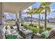 Relaxing front porch with wicker furniture and palm trees at 2429 Volunteer Ave, Kissimmee, FL 34744