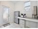 Home office with built-in desk and exterior access at 2429 Volunteer Ave, Kissimmee, FL 34744
