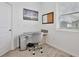 Bright home office with a gray chair and window at 2429 Volunteer Ave, Kissimmee, FL 34744