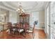 Formal dining room with hardwood floors, chandelier and china cabinet at 2438 River Rise Ct, Orlando, FL 32828