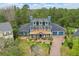 Inviting two-story home with copper porch roof and a beautiful landscaped front yard at 2438 River Rise Ct, Orlando, FL 32828