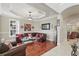 Comfortable living room featuring hardwood floors, crown molding, and recessed lighting at 2438 River Rise Ct, Orlando, FL 32828