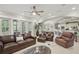Comfortable and expansive living room with views of the kitchen and dining area at 2438 River Rise Ct, Orlando, FL 32828