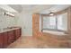 Elegant bathroom featuring a soaking tub, tiled shower, and ample counter space at 2438 River Rise Ct, Orlando, FL 32828