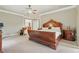 Spacious main bedroom features tray ceiling, ceiling fan and en-suite bathroom at 2438 River Rise Ct, Orlando, FL 32828