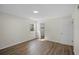 Well-lit bedroom featuring wood-look floors and a closet at 254 Lake Thomas Dr, Winter Haven, FL 33880