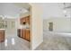 The kitchen with wooden cabinetry and tiled floors connects seamlessly to other living spaces at 2751 Shortleaf Ct, Kissimmee, FL 34746