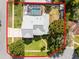 Aerial view showcases property with mature trees and a screened-in pool at 309 Oakwood Ct, Lake Mary, FL 32746