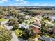 Aerial view of a single-Gathering home with a well-manicured lawn and mature trees at 309 Oakwood Ct, Lake Mary, FL 32746