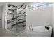 Stylish bathroom features a modern shower with black and white tile and a luxurious soaking tub at 309 Oakwood Ct, Lake Mary, FL 32746