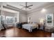 Spacious main bedroom boasts tray ceiling, recessed lighting, and gleaming wood floors at 309 Oakwood Ct, Lake Mary, FL 32746