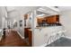 Well-appointed kitchen with granite countertops, modern appliances, bar seating and seamless flow to other rooms at 309 Oakwood Ct, Lake Mary, FL 32746