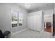 Inviting room with large window, closet, tile floor and view to dining area at 309 Oakwood Ct, Lake Mary, FL 32746