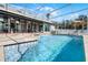 Beautiful screened-in pool featuring clear blue water and room for seating at 309 Oakwood Ct, Lake Mary, FL 32746