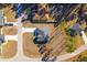 Birds eye view of a home with a long driveway and surrounding landscape at 325 Marion Oaks Golf Way, Ocala, FL 34473