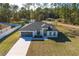 Charming single-story home with well-manicured lawn and attached two-car garage at 325 Marion Oaks Golf Way, Ocala, FL 34473