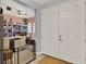 Inviting foyer featuring neutral walls, a tile floor, and a glimpse into a craft room at 332 Terracotta Ter, Howey In The Hills, FL 34737