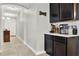 Hallway with view of the kitchen at 332 Terracotta Ter, Howey In The Hills, FL 34737