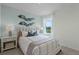 Bedroom with a comfortable bed and calming decor at 3516 Fort Mellon Ln, Sanford, FL 32773