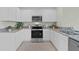 Modern kitchen with stainless steel appliances and granite countertops at 3516 Fort Mellon Ln, Sanford, FL 32773
