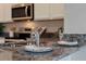 Kitchen with granite countertop and stainless steel appliances at 3516 Fort Mellon Ln, Sanford, FL 32773