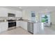 Modern kitchen with stainless steel appliances and granite countertops at 3516 Fort Mellon Ln, Sanford, FL 32773