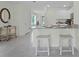Modern kitchen features a breakfast bar and granite countertops at 3516 Fort Mellon Ln, Sanford, FL 32773