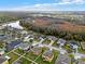 A high angle view of a neighborhood bordering a lush nature preserve and a pond at 3773 Moon Dancer Pl, St Cloud, FL 34772