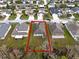 A home is marked by a red outline, surrounded by other homes and a lush landscape at 3773 Moon Dancer Pl, St Cloud, FL 34772