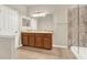 Bright bathroom featuring a double sink vanity and marbled glass shower at 3773 Moon Dancer Pl, St Cloud, FL 34772