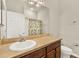 Bright bathroom featuring a single sink vanity and a toilet at 3773 Moon Dancer Pl, St Cloud, FL 34772