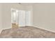 Neutral carpeted bedroom with a view to adjacent rooms at 3773 Moon Dancer Pl, St Cloud, FL 34772