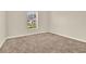 Bright bedroom featuring neutral walls and cozy carpet at 3773 Moon Dancer Pl, St Cloud, FL 34772